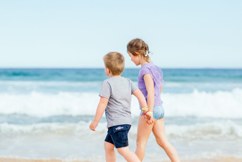 Boy Girl Young Siblings Holding Hands Walking Beach